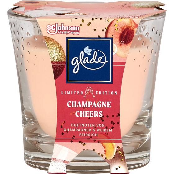 Sviečka Glade Champagne Cheers s vôňou šampanského a sviežou broskyňovou vôňou v skle, doba horenia až 38 hodín 129 g